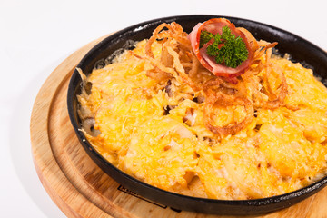 fried potatoes with cheese and meat