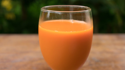 Fresh carrot juice in glass