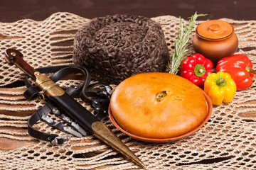 Pie on the table with food set