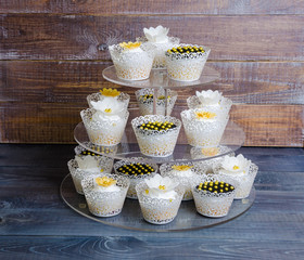 wedding gold and black cupcakes in lace wrappers
