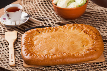 Pie on the table with food set
