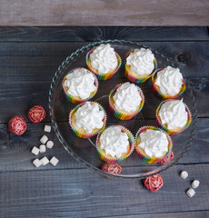 rainbow merengue cupcakes on with rattan decoration