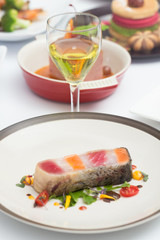 Steak layer fish and whire wine