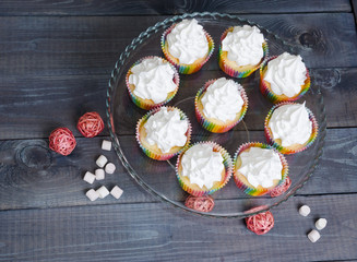 rainbow merengue cupcakes on with rattan decoration