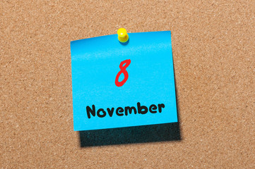 November 8th. Day 8 of month, color sticker calendar on notice board. Autumn time. Empty space for text
