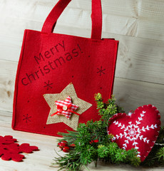 Red bag with the inscription Merry Christmas.