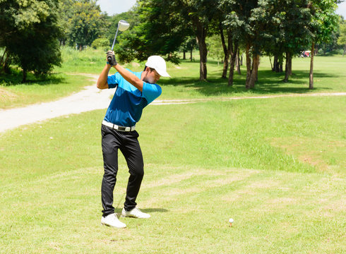 Handsome Asian Golfers Man Putt Golf On Green.