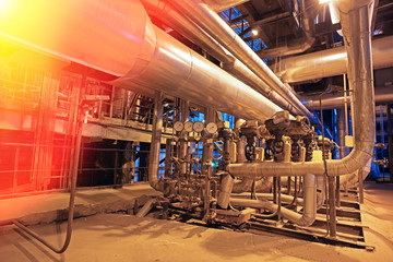 Equipment, cables and piping as found inside of a modern industr