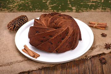 Traditional Christmas chocolate cake on wooden table