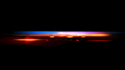 Beautiful light flares. Glowing streaks on dark background. Police light flares   © rybindmitriy