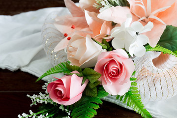 Bouquet of artificial flowers on white cloth beautiful,  Selective focus