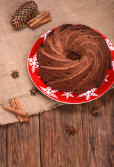 Traditional Christmas chocolate cake on wooden table