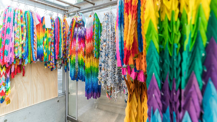Thousands of colorful origami cranes from all over the world being offered around the Children's Peace monument commemorating for Child Victims of Nuclear and conventional War , Hiroshima , Japan