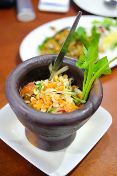 Famous Thai food, papaya salad served in mortar