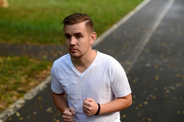 Blonde attractive man running