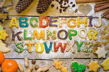 seasonal decoration and cookie alphabet on wooden table