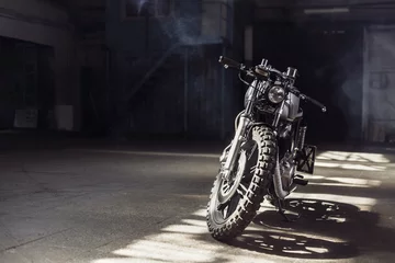 Papier Peint photo Moto motorcycle standing in dark building in rays of sunlight
