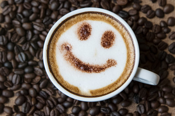 Top view white cup of latte art happy smile face