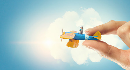 Student girl in old airplane . Mixed media