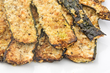 Baked zucchini slices closeup