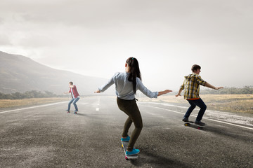 Teenagers ride skateboards . Mixed media