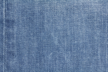 Denim jeans texture or denim jeans background with seam. Old grunge vintage denim jeans. Stitched...