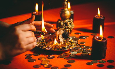 a witch holds a ritual for money