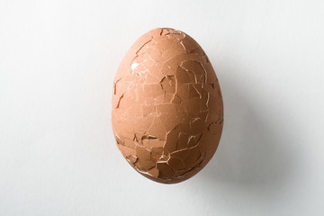 Broken Brown Egg on White Background
