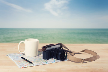 Fototapeta na wymiar Travel and vacation background with items over wooden table