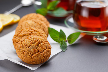 Homemade heart shape cookies and tea on the table