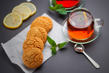 Homemade heart shape cookies and tea on the table
