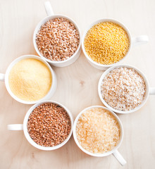 Different kinds of cereals: oats, millet, rice, buckwheat, wheat, spelt 