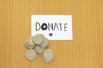 Coin and the note with donate money