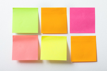 collection of colorful post it paper note close up on white background