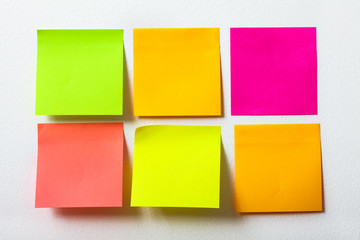 collection of colorful post it paper note close up on white background