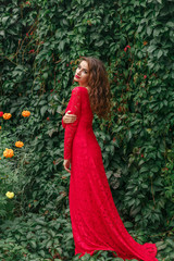 beautiful young woman in long red dress