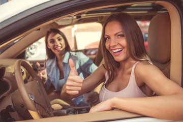 Girls driving the car