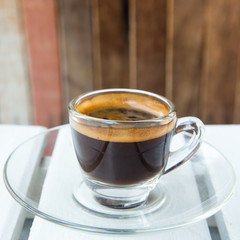 Cup of coffee wood background
