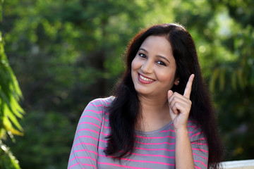 Happy young woman at outdoors