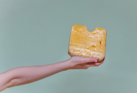 arm  with a piece of cheese