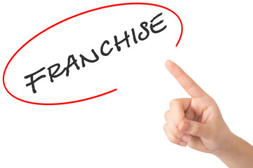 Hand of a young girl points to a word