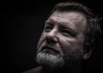 Portrait of a bearded man. Grimace. Toned