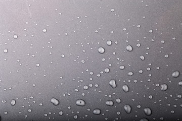 Drops of water on a color background. Gray. Toned