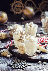 Hot white chocolate with marshmallows in a xmas decoration with