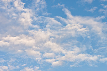 Texture of fluffy white cloud on bright blue sky