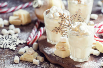 Hot white chocolate with marshmallows in a xmas decoration with