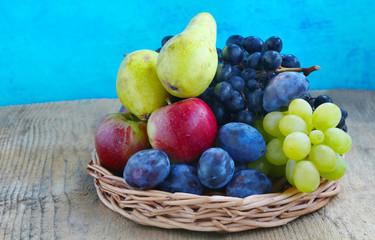 Autumn fruits assortment with grapes, plums, pears and apples