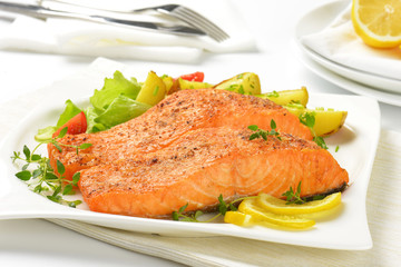 dish of salmon fillets with roasted potatoes