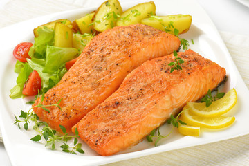 dish of salmon fillets with roasted potatoes