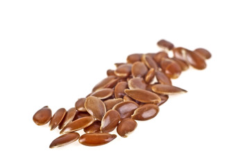 Close up of flax seeds isolated on white background